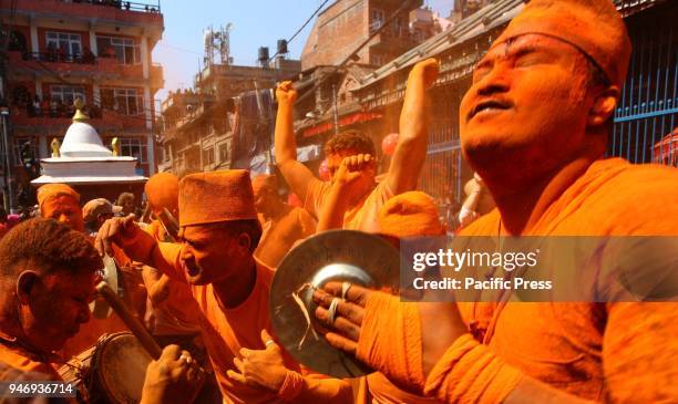 People play traditional music and dance in ecstasy during the celebration of Sindoor Jatra Festival at Thimi in Bhaktapur. The festival is celebrated...