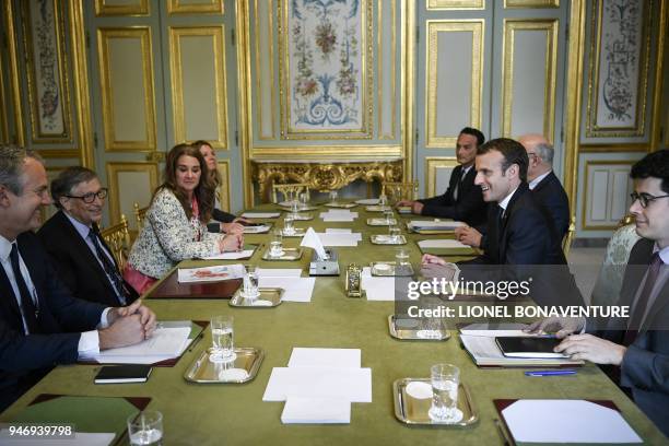 French President Emmanuel Macron attends a meeting with Microsoft founder and billionaire philanthropist Bill Gates and his wife Melinda Gates at the...