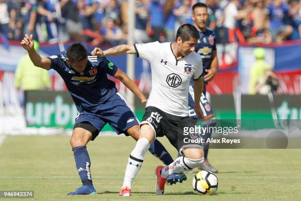 Jaime Valdes of Colo Colo fights for the ball with Matias Rodriguez of U de Chile during a match between U de Chile and Colo Colo as part of Torneo...