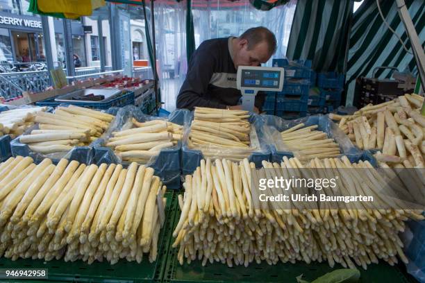 Asparagus time. Scene on the Bonn market place,