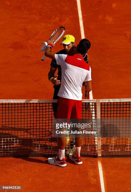 Novak Djokovic of Serbia and Dusan Lajovic of Serbia hug after their singles match against Dusan Lajovic of Serbia during day two of ATP Masters...
