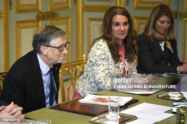 Microsoft founder and billionaire philanthropist Bill Gates and his wife Melinda Gates attend a meeting with French President at the Elysee...