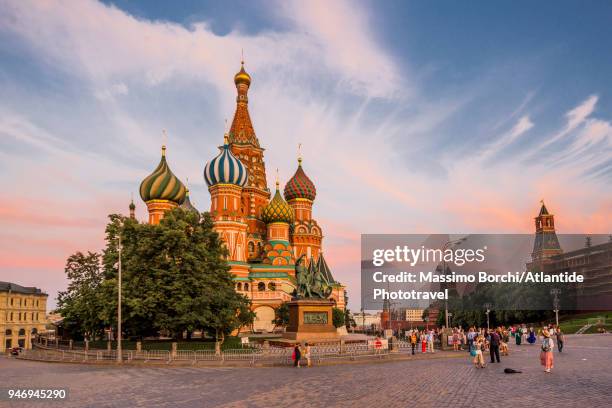 red square, the cathedral of vasily commonly known as saint basil's cathedral, the walls of the moscow kremlin on the right - orthodox saint basil day stock pictures, royalty-free photos & images