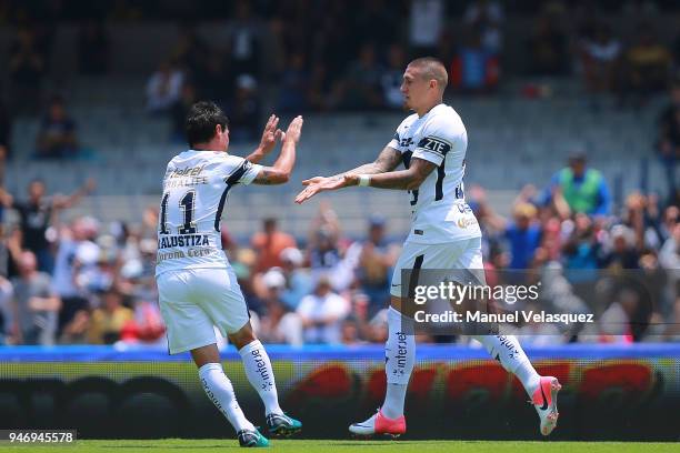 Nicolas Castillo of Pumas celebrates with Gustavo Alustiza after scoring the first of his team goal during the 15th round match between Pumas UNAM...