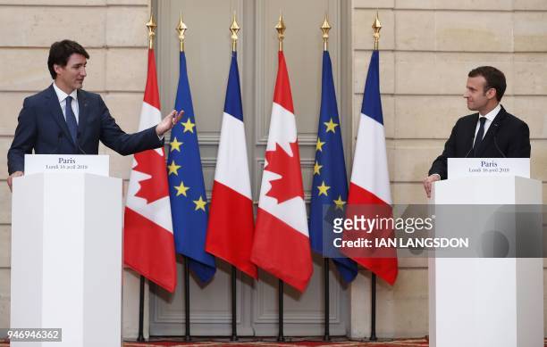 French President Emmanuel Macron and Canadian Prime Minister Justin Trudeau hold a joint press conference at the Elysee Palace in Paris on April 16,...