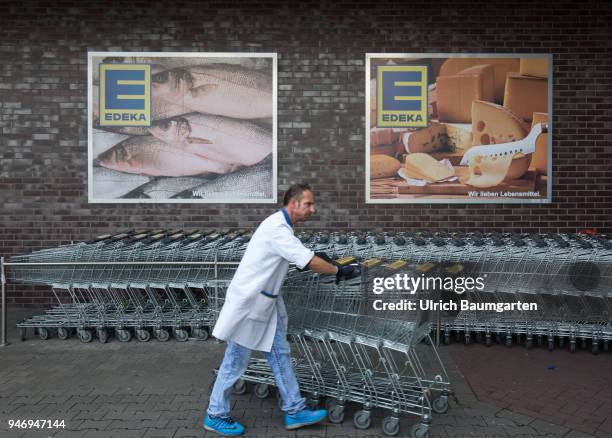 Edeka supermarket - advertising poster and shopping carts.