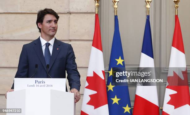 French President Emmanuel Macron and Canadian Prime Minister Justin Trudeau hold a joint press conference at the Elysee Palace in Paris on April 16,...