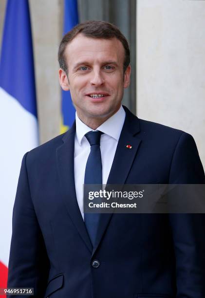 French president Emmanuel Macron smiles as Canadian Prime Minister Justin Trudeau leaves the Elysee Palace after their meeting on April 16, 2018 in...