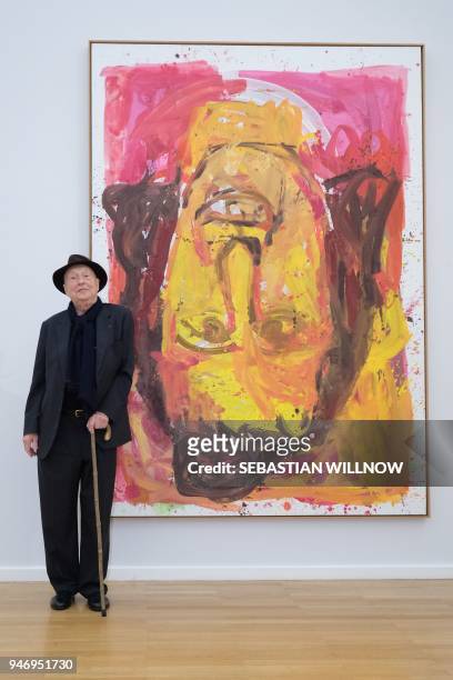 German artist Georg Baselitz poses next to his painting "Schwester Rosi III" from 1995 at his exhibition in Chemnitz, eastern Germany on April 16,...