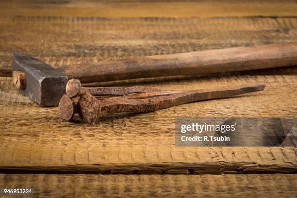 vintage old hammer with rusty nails on wood table background - bricolaje stock pictures, royalty-free photos & images