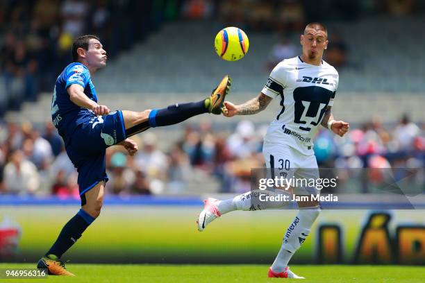 Brayan Angulo of Puebla and Nicolas Castillo of Pumas fight for the ball during the 15th round match between Pumas UNAM and Puebla as part of the...
