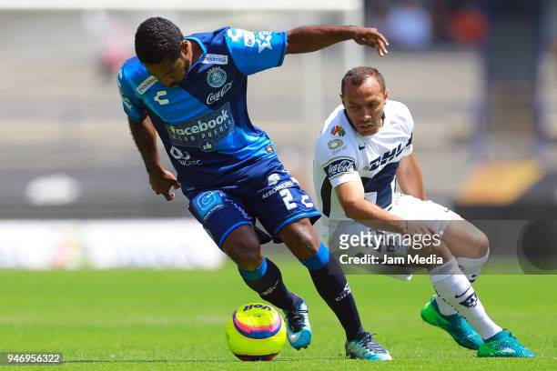 Brayan Angulo of Puebla and Marcelo Diaz of Pumas fight for the ball during the 15th round match between Pumas UNAM and Puebla as part of the Torneo...