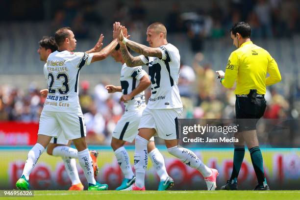 Nicolas Castillo of Pumas celebrates with Marcelo Diaz after scoring the first goal of his team during the 15th round match between Pumas UNAM and...