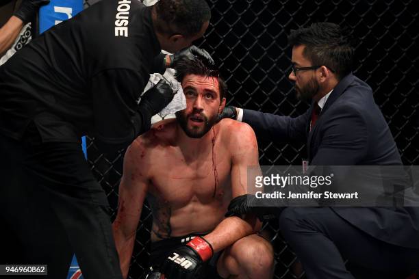 Carlos Condit is examined after the welterweight fight against Alex Oliveira during the UFC Fight Night at Gila River Arena on April 14, 2018 in...