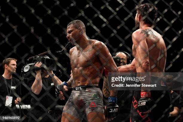 Alex Oliveira of Brazil celebrates his victory over Carlos Condit in their welterweight fight during the UFC Fight Night at Gila River Arena on April...