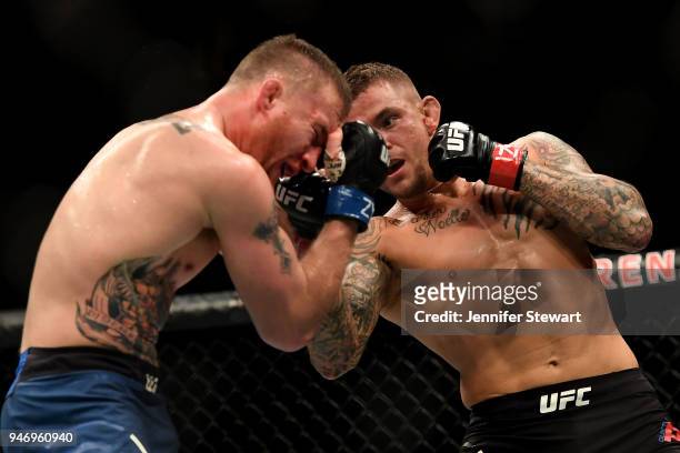 Dustin Poirier punches Justin Gaethje in their lightweight fight during the UFC Fight Night event at Gila River Arena on April 14, 2018 in Glendale,...