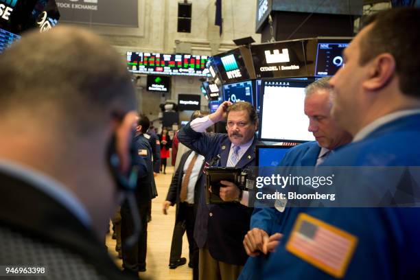 Traders work on the floor of the New York Stock Exchange in New York, U.S., on Monday, April 16, 2018. U.S. Stocks rallied and Treasuries slid as...