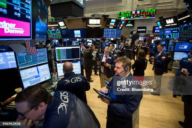 Traders work on the floor of the New York Stock Exchange in New York, U.S., on Monday, April 16, 2018. U.S. Stocks rallied and Treasuries slid as...