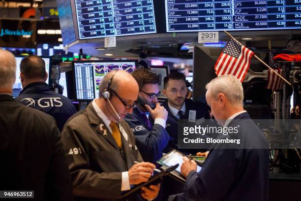 Traders work on the floor of the New York Stock Exchange in New York, U.S., on Monday, April 16, 2018. U.S. Stocks rallied and Treasuries slid as...