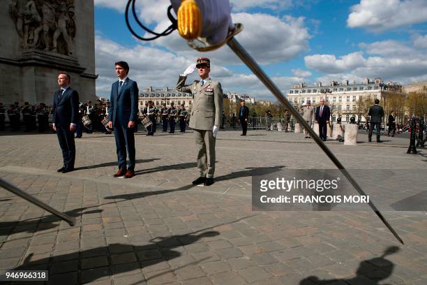 Canadian Prime Minister Justin Trudeau , flanked with French Junior Minister for Foreign Affairs Jean-Baptiste Lemoyne , attends a wreath laying...