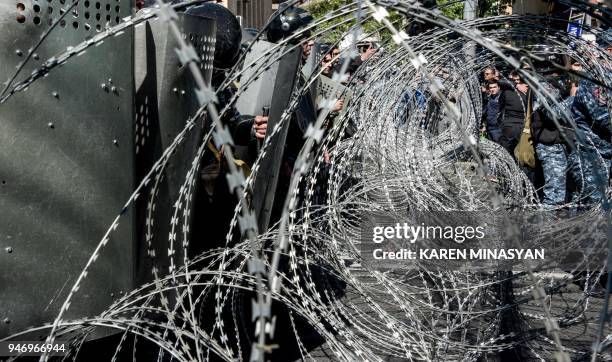 Armenian special police forces block a street during an opposition rally in central Yerevan on April 16, 2018. An opposition leader and several dozen...