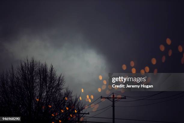 lights reflected in a window at dusk - bloomington indiana stock-fotos und bilder