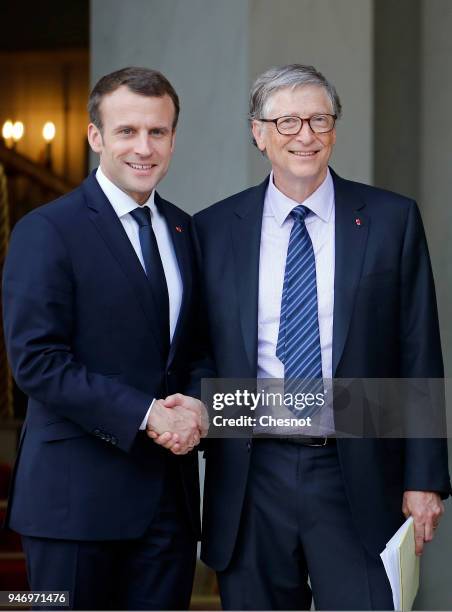 French president Emmanuel Macron accompanies Co-chairman and co-founder of the The Bill and Melinda Gates Foundation, Bill Gates after their meeting...