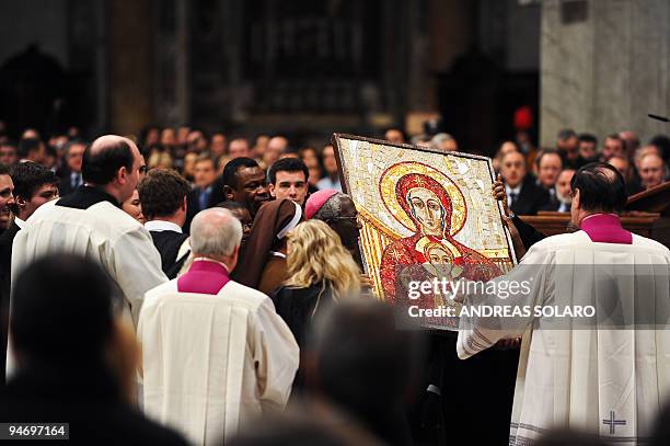 The icona of " Maria Sedes Sapieniae" is carried by African university students during vespers celebrated by Pope Benedict XVI in St Peter's Basilica...