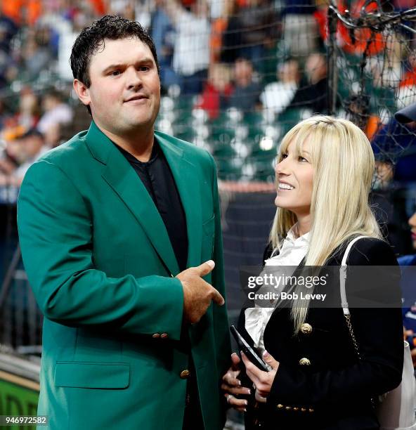 Patrick Reed, 2018 Masters champion and wife Justine after receiving a Houston Astros jersey from owner Jim Crane at Minute Maid Park on April 14,...