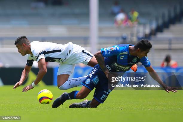 Pablo Barrera of Pumas struggles for the ball against Jose Guerrero of Puebla during the 15th round match between Pumas UNAM and Puebla as part of...