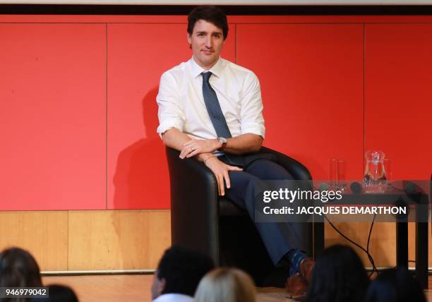 Canadian Prime Minister Justin Trudeau looks on as he sits on stage before delivering a speech at the French school of Political Science, Sciences Po...