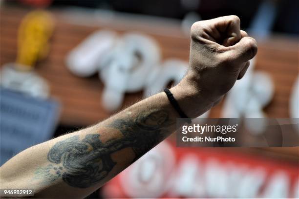 Man holds up his fist during a demonstration staged by Turkey's main opposition Republican People's Party , protesting the state of emergency on the...