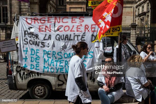 About fifty people, doctors, nurses and caregivers, demonstrated on April 16, 2018 on the Place de la Comedie in Lyon, France. Lying on the ground,...