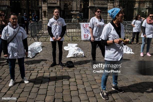 About fifty people, doctors, nurses and caregivers, demonstrated on April 16, 2018 on the Place de la Comedie in Lyon, France. Lying on the ground,...