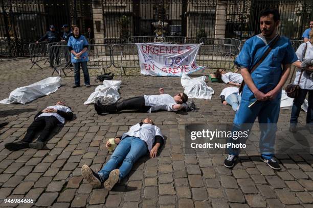 About fifty people, doctors, nurses and caregivers, demonstrated on April 16, 2018 on the Place de la Comedie in Lyon, France. Lying on the ground,...