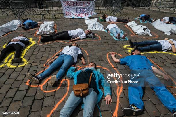 About fifty people, doctors, nurses and caregivers, demonstrated on April 16, 2018 on the Place de la Comedie in Lyon, France. Lying on the ground,...