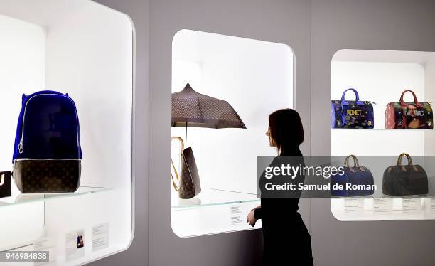 Visitor observes a work by Lous Vuitton during 'Time Capsule' by Louis Vuitton Exhibition on April 16, 2018 in Madrid, Spain.