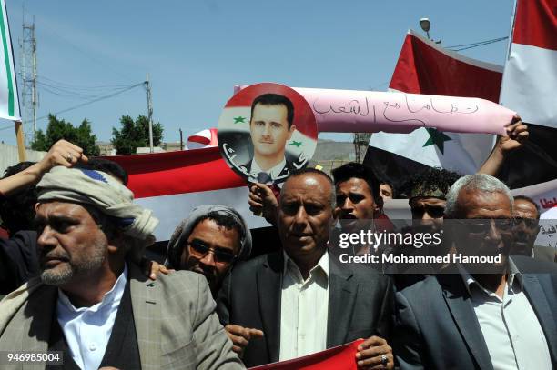 Yemenis protest against U.S. Allied missile strikes against Syria outside the Syrian embassy on April 16, 2018 in Sana'a, Yemen. The U.S., Great...