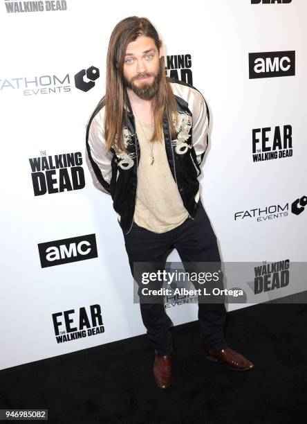 Actor Tom Payne arrives for the Fathom Events And AMC's "Survival Sunday: The Walking Dead And Fear The Walking Dead" held at AMC Century City 15...