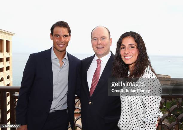 Rafael Nadal of Spain poses on his balcony with his girlfriend Maria Francisca Perello and Albert II, Prince of Monaco during Day Two of the ATP...