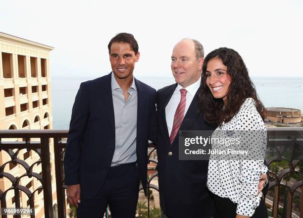 Rafael Nadal of Spain poses on his balcony with his girlfriend Maria Francisca Perello and Albert II, Prince of Monaco during Day Two of the ATP...