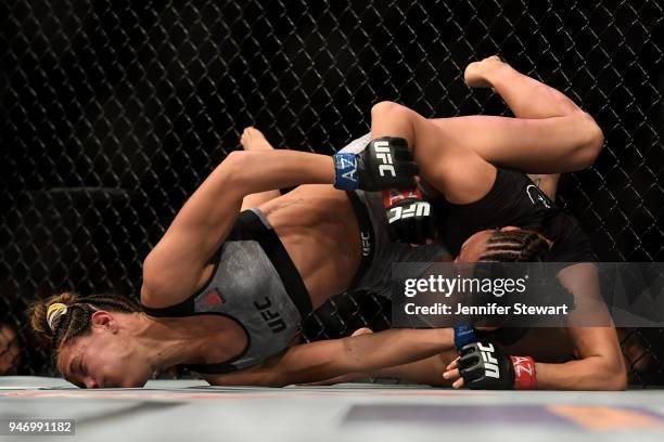 Cortney Casey fights with Michelle Waterson in their womens strawweight fight during the UFC Fight Night at Gila River Arena on April 14, 2018 in...