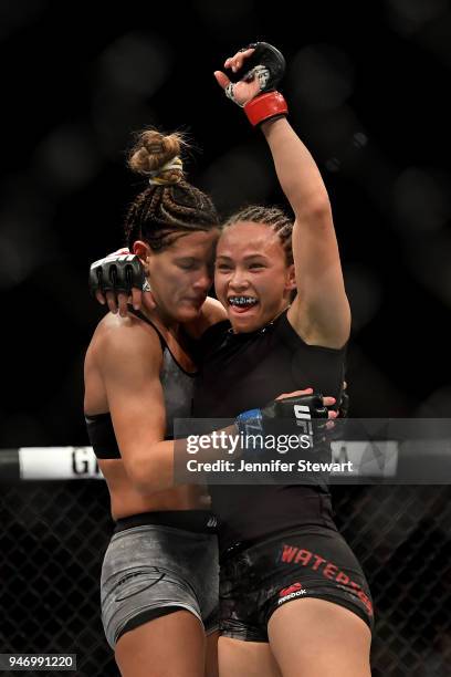 Cortney Casey hugs Michelle Waterson after their womens strawweight fight during the UFC Fight Night at Gila River Arena on April 14, 2018 in...