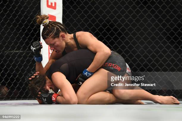 Cortney Casey strikes Michelle Waterson in their womens strawweight fight during the UFC Fight Night at Gila River Arena on April 14, 2018 in...