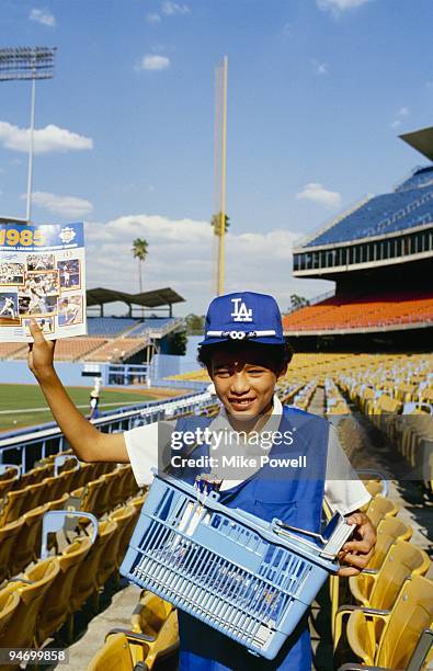 Boy gets ready to sell programs for 1985 National League Championship Series Game Two between the St. Louis Cardinals and Los Angeles Dodgers at...