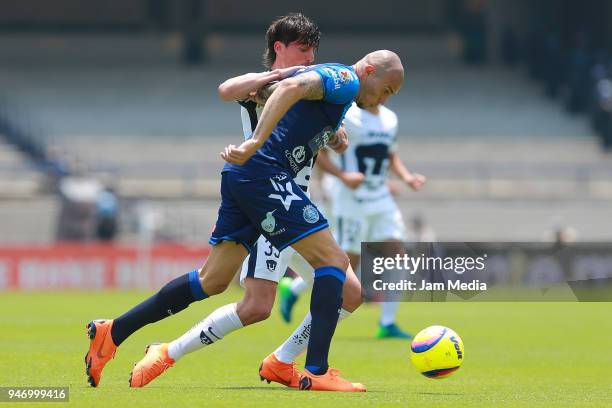 Mauro Formica of Pumas and Jorge Enriquez of Puebla fight for the ball during the 15th round match between Pumas UNAM and Puebla as part of the...