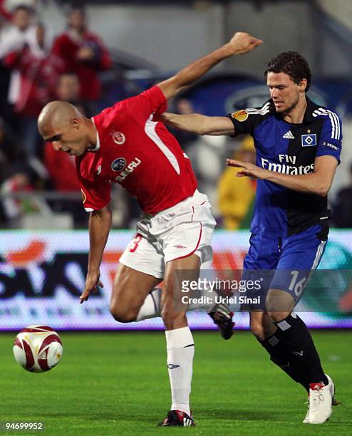 Marcus Berg of HSV and Douglas da Silva of Tel Aviv battle for the ball during their Group C UEFA Europa League match on December 17, 2009 in Tel...