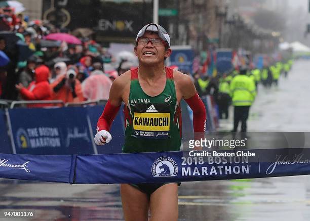 Boston Marathon men' s winner Yuki Kawauchi crosses the finish line on Boylston Street in Boston on April 16, 2018.