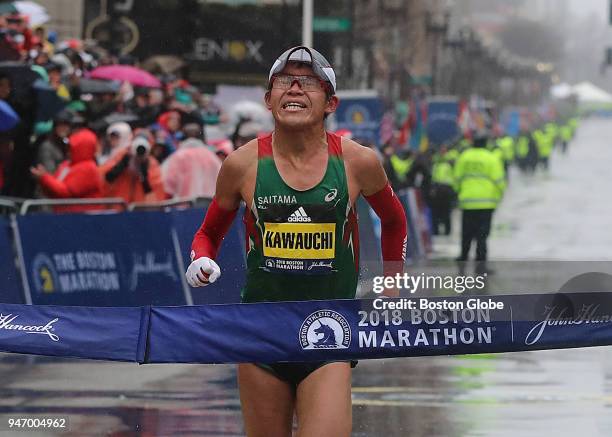 Boston Marathon men' s winner Yuki Kawauchi crosses the finish line on Boylston Street in Boston on April 16, 2018.