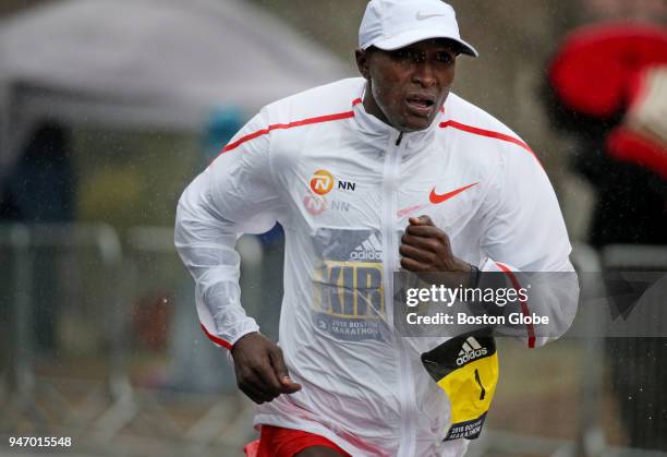 Geoffrey Kirui runs through Heartbreak Hill during the Boston Marathon in Newton, Mass., April 16, 2018.